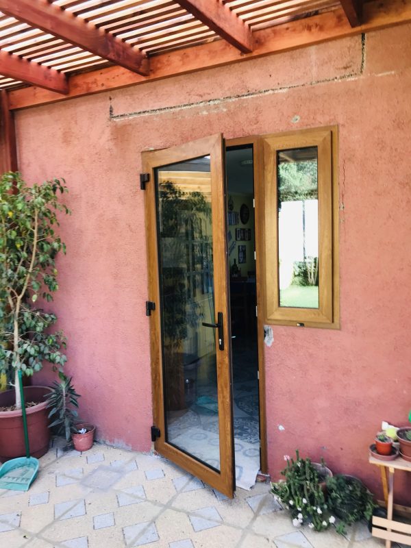 Puerta de PVC color Roble Termopanel
